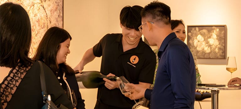 Guided Wine Tasting experience with host pouring wine for guests here in Singapore