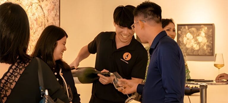 Wine Tasting Singapore Our staff pouring a glass for a client during a Wine Tasting session with us in Singapore (for widescreen)